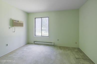 Ground level living in 55+ Covered Bridge II with two bedrooms on Pine Brook Golf Course in New Jersey - for sale on GolfHomes.com, golf home, golf lot