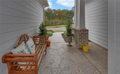 DUNWOODY Model  Covered front porch with brick elevation.  This on Chateau Elan Golf Club  in Georgia - for sale on GolfHomes.com, golf home, golf lot