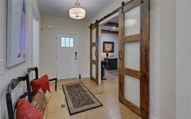 DUNWOODY Model  Covered front porch with brick elevation.  This on Chateau Elan Golf Club  in Georgia - for sale on GolfHomes.com, golf home, golf lot