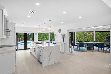 An exceptional, fully renovated retreat tucked behind a tranquil on Hamlet Country Club in Florida - for sale on GolfHomes.com, golf home, golf lot