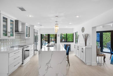 An exceptional, fully renovated retreat tucked behind a tranquil on Hamlet Country Club in Florida - for sale on GolfHomes.com, golf home, golf lot