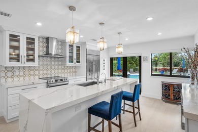 An exceptional, fully renovated retreat tucked behind a tranquil on Hamlet Country Club in Florida - for sale on GolfHomes.com, golf home, golf lot