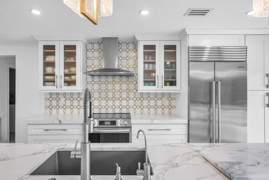 An exceptional, fully renovated retreat tucked behind a tranquil on Hamlet Country Club in Florida - for sale on GolfHomes.com, golf home, golf lot