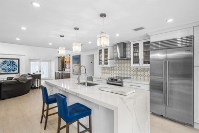 An exceptional, fully renovated retreat tucked behind a tranquil on Hamlet Country Club in Florida - for sale on GolfHomes.com, golf home, golf lot