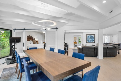 An exceptional, fully renovated retreat tucked behind a tranquil on Hamlet Country Club in Florida - for sale on GolfHomes.com, golf home, golf lot