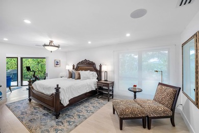 An exceptional, fully renovated retreat tucked behind a tranquil on Hamlet Country Club in Florida - for sale on GolfHomes.com, golf home, golf lot