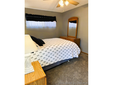 Enjoy effortless lake living in this well-kept, turn-key 1 bed on Sycamore Creek Golf Club in Missouri - for sale on GolfHomes.com, golf home, golf lot