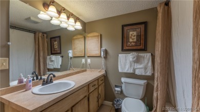 Located in the exclusive golf cart community of Tan Tar A on The Oaks Golf Course in Missouri - for sale on GolfHomes.com, golf home, golf lot