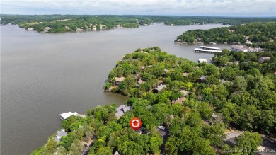 Located in the exclusive golf cart community of Tan Tar A on The Oaks Golf Course in Missouri - for sale on GolfHomes.com, golf home, golf lot