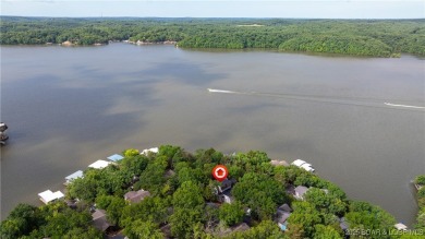 Located in the exclusive golf cart community of Tan Tar A on The Oaks Golf Course in Missouri - for sale on GolfHomes.com, golf home, golf lot