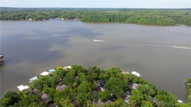 Located in the exclusive golf cart community of Tan Tar A on The Oaks Golf Course in Missouri - for sale on GolfHomes.com, golf home, golf lot