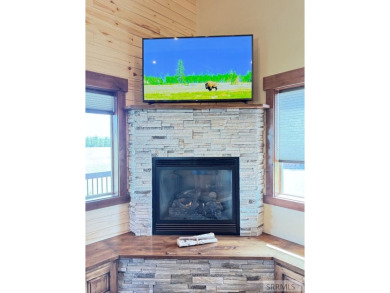 Stunning cabin in Island Park where rustic elegance meets on Island Park Village Resort Golf Course in Idaho - for sale on GolfHomes.com, golf home, golf lot