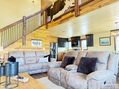 Stunning cabin in Island Park where rustic elegance meets on Island Park Village Resort Golf Course in Idaho - for sale on GolfHomes.com, golf home, golf lot