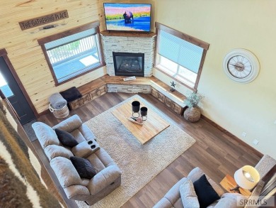 Stunning cabin in Island Park where rustic elegance meets on Island Park Village Resort Golf Course in Idaho - for sale on GolfHomes.com, golf home, golf lot