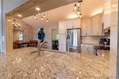 Located in the iconic Tan Tar A Estates, just steps from on The Oaks Golf Course in Missouri - for sale on GolfHomes.com, golf home, golf lot