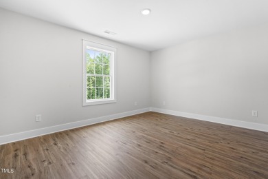 This stunning 4-bedroom, 2.5-bath home perfectly situated on a on Olde Liberty Golf and Country Club in North Carolina - for sale on GolfHomes.com, golf home, golf lot