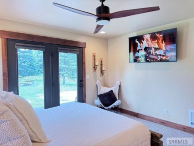 Stunning cabin in Island Park where rustic elegance meets on Island Park Village Resort Golf Course in Idaho - for sale on GolfHomes.com, golf home, golf lot