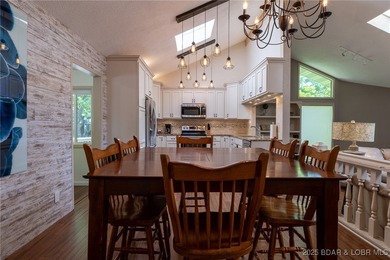 Located in the iconic Tan Tar A Estates, just steps from on The Oaks Golf Course in Missouri - for sale on GolfHomes.com, golf home, golf lot