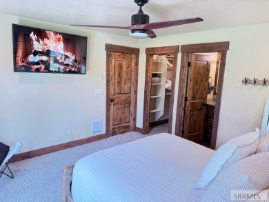 Stunning cabin in Island Park where rustic elegance meets on Island Park Village Resort Golf Course in Idaho - for sale on GolfHomes.com, golf home, golf lot
