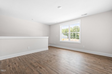 This stunning 4-bedroom, 2.5-bath home perfectly situated on a on Olde Liberty Golf and Country Club in North Carolina - for sale on GolfHomes.com, golf home, golf lot
