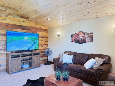 Stunning cabin in Island Park where rustic elegance meets on Island Park Village Resort Golf Course in Idaho - for sale on GolfHomes.com, golf home, golf lot