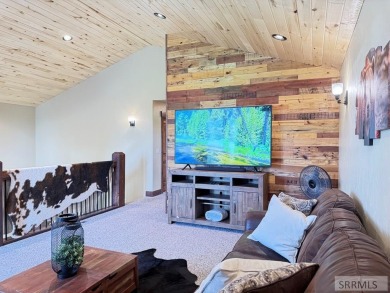 Stunning cabin in Island Park where rustic elegance meets on Island Park Village Resort Golf Course in Idaho - for sale on GolfHomes.com, golf home, golf lot