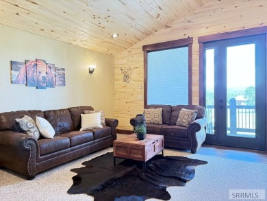 Stunning cabin in Island Park where rustic elegance meets on Island Park Village Resort Golf Course in Idaho - for sale on GolfHomes.com, golf home, golf lot