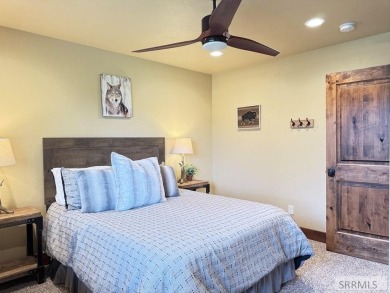 Stunning cabin in Island Park where rustic elegance meets on Island Park Village Resort Golf Course in Idaho - for sale on GolfHomes.com, golf home, golf lot