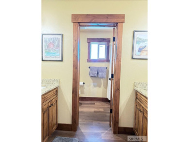 Stunning cabin in Island Park where rustic elegance meets on Island Park Village Resort Golf Course in Idaho - for sale on GolfHomes.com, golf home, golf lot
