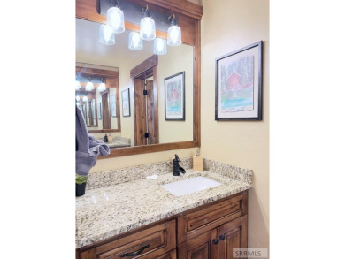 Stunning cabin in Island Park where rustic elegance meets on Island Park Village Resort Golf Course in Idaho - for sale on GolfHomes.com, golf home, golf lot