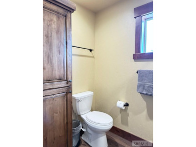 Stunning cabin in Island Park where rustic elegance meets on Island Park Village Resort Golf Course in Idaho - for sale on GolfHomes.com, golf home, golf lot