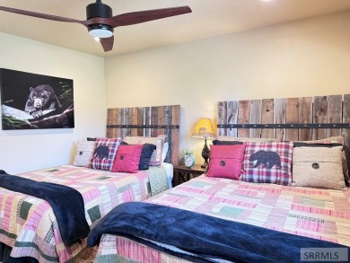Stunning cabin in Island Park where rustic elegance meets on Island Park Village Resort Golf Course in Idaho - for sale on GolfHomes.com, golf home, golf lot