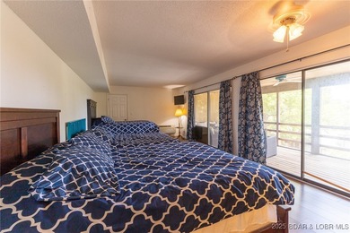 Located in the iconic Tan Tar A Estates, just steps from on The Oaks Golf Course in Missouri - for sale on GolfHomes.com, golf home, golf lot