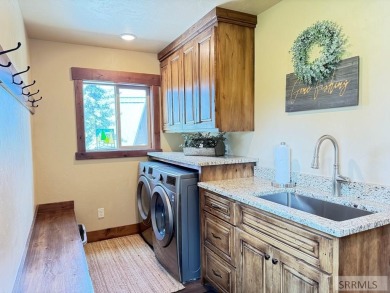 Stunning cabin in Island Park where rustic elegance meets on Island Park Village Resort Golf Course in Idaho - for sale on GolfHomes.com, golf home, golf lot