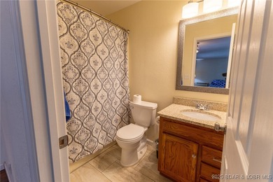 Located in the iconic Tan Tar A Estates, just steps from on The Oaks Golf Course in Missouri - for sale on GolfHomes.com, golf home, golf lot