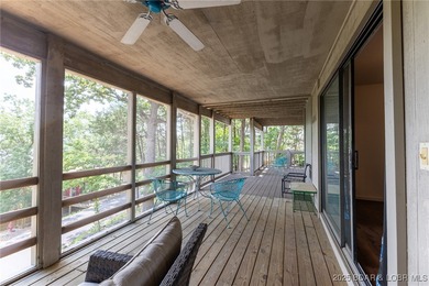 Located in the iconic Tan Tar A Estates, just steps from on The Oaks Golf Course in Missouri - for sale on GolfHomes.com, golf home, golf lot