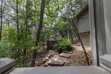 Located in the iconic Tan Tar A Estates, just steps from on The Oaks Golf Course in Missouri - for sale on GolfHomes.com, golf home, golf lot