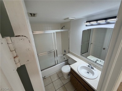 Solid concrete block duplex featuring two 2-bedroom, 2-bath on Estero Country Club in Florida - for sale on GolfHomes.com, golf home, golf lot