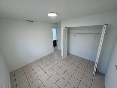 Solid concrete block duplex featuring two 2-bedroom, 2-bath on Estero Country Club in Florida - for sale on GolfHomes.com, golf home, golf lot