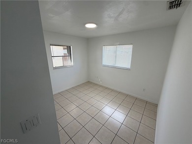 Solid concrete block duplex featuring two 2-bedroom, 2-bath on Estero Country Club in Florida - for sale on GolfHomes.com, golf home, golf lot