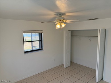 Solid concrete block duplex featuring two 2-bedroom, 2-bath on Estero Country Club in Florida - for sale on GolfHomes.com, golf home, golf lot