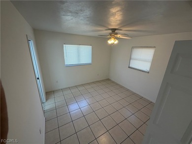 Solid concrete block duplex featuring two 2-bedroom, 2-bath on Estero Country Club in Florida - for sale on GolfHomes.com, golf home, golf lot