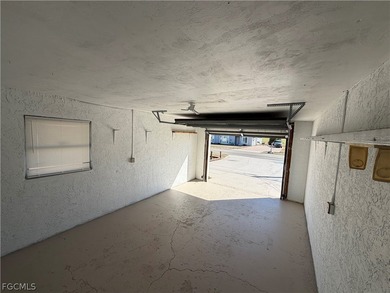 Solid concrete block duplex featuring two 2-bedroom, 2-bath on Estero Country Club in Florida - for sale on GolfHomes.com, golf home, golf lot