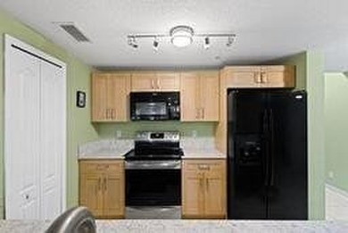 Don't miss this 1st floor unit on the 3rd hole of Gator Trace on Gator Trace Golf and Country Club in Florida - for sale on GolfHomes.com, golf home, golf lot