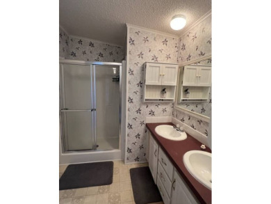 Beautiful waterfront home in The Hamptons Golf and Country Club on Hamptons Golf Club in Florida - for sale on GolfHomes.com, golf home, golf lot