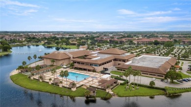 Experience luxury living in this stunning, top-floor corner unit on Flamingo Lakes Country Club in Florida - for sale on GolfHomes.com, golf home, golf lot