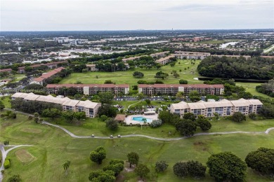 Experience luxury living in this stunning, top-floor corner unit on Flamingo Lakes Country Club in Florida - for sale on GolfHomes.com, golf home, golf lot