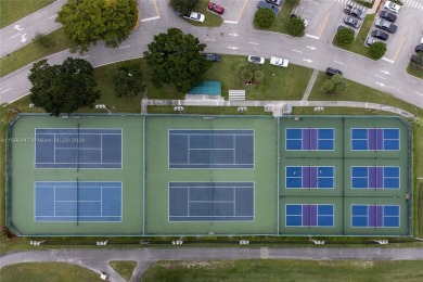 Experience luxury living in this stunning, top-floor corner unit on Flamingo Lakes Country Club in Florida - for sale on GolfHomes.com, golf home, golf lot