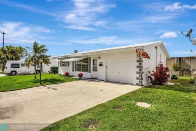 Welcome to this charming two bedroom, one and a half bath home on Leisureville Community Association in Florida - for sale on GolfHomes.com, golf home, golf lot