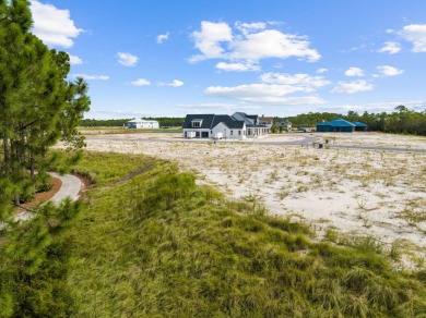 This homesite is located on the 15th green at the prestigious on Camp Creek Golf Course in Florida - for sale on GolfHomes.com, golf home, golf lot